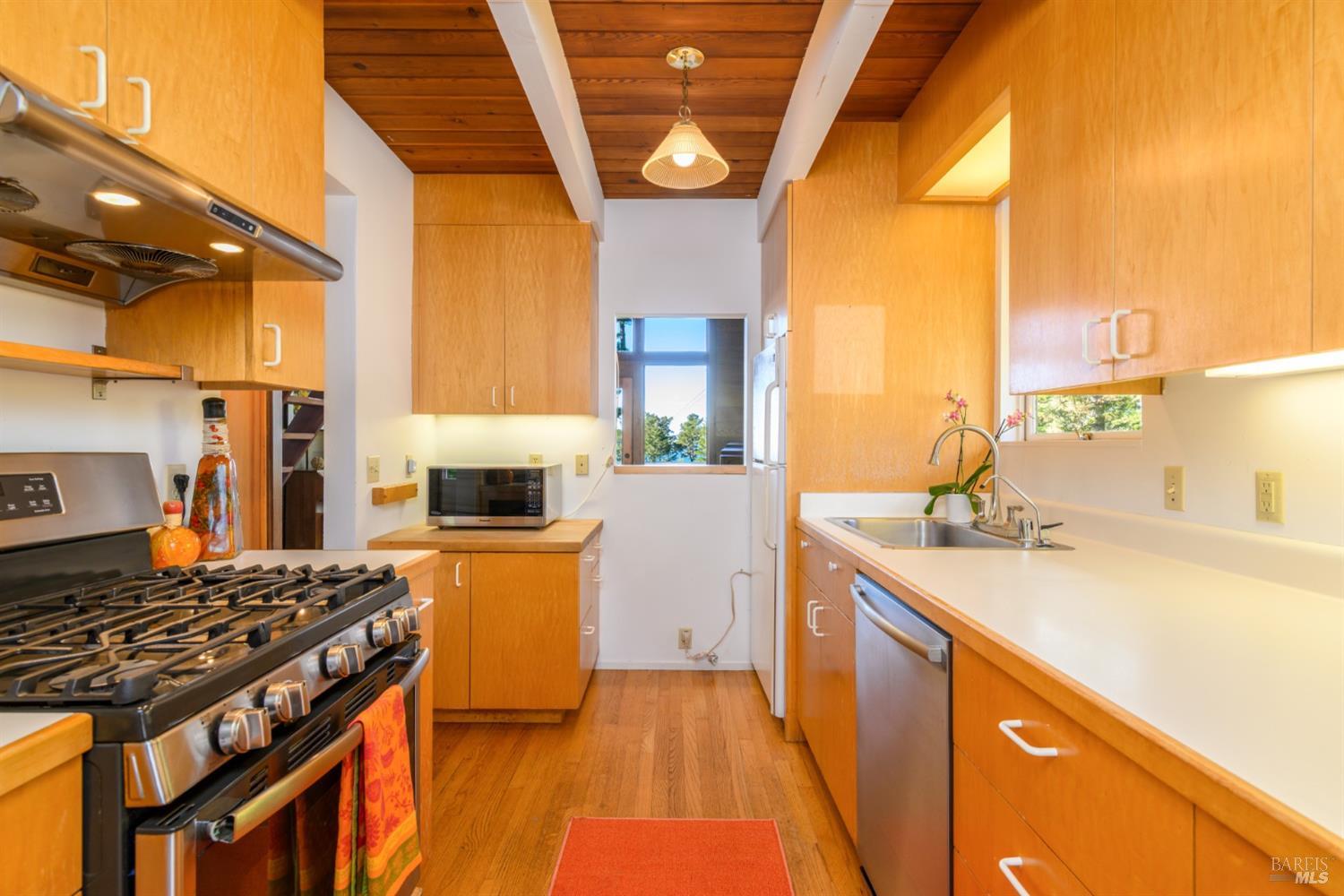 35402 Fly Cloud Road The Sea Ranch, CA 95497 - Photo 22 of 46 Galley kitchen with Oak wood floors, beautiful wood cabinets, gas oven/range, dishwasher...