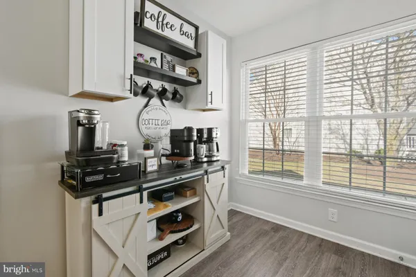 a kitchen with stainless steel appliances a sink a stove and a window