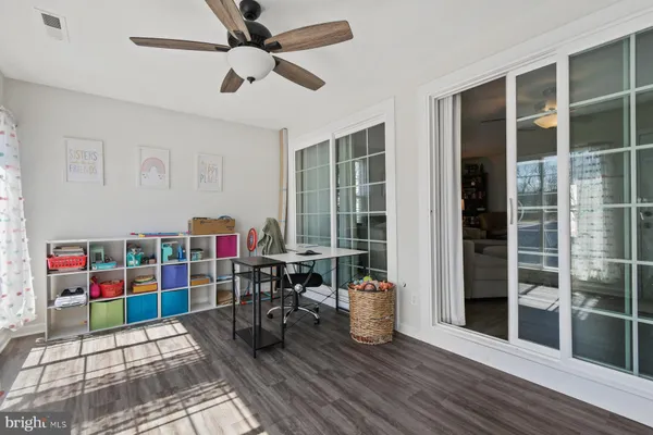 a view of a workspace with furniture and entryway