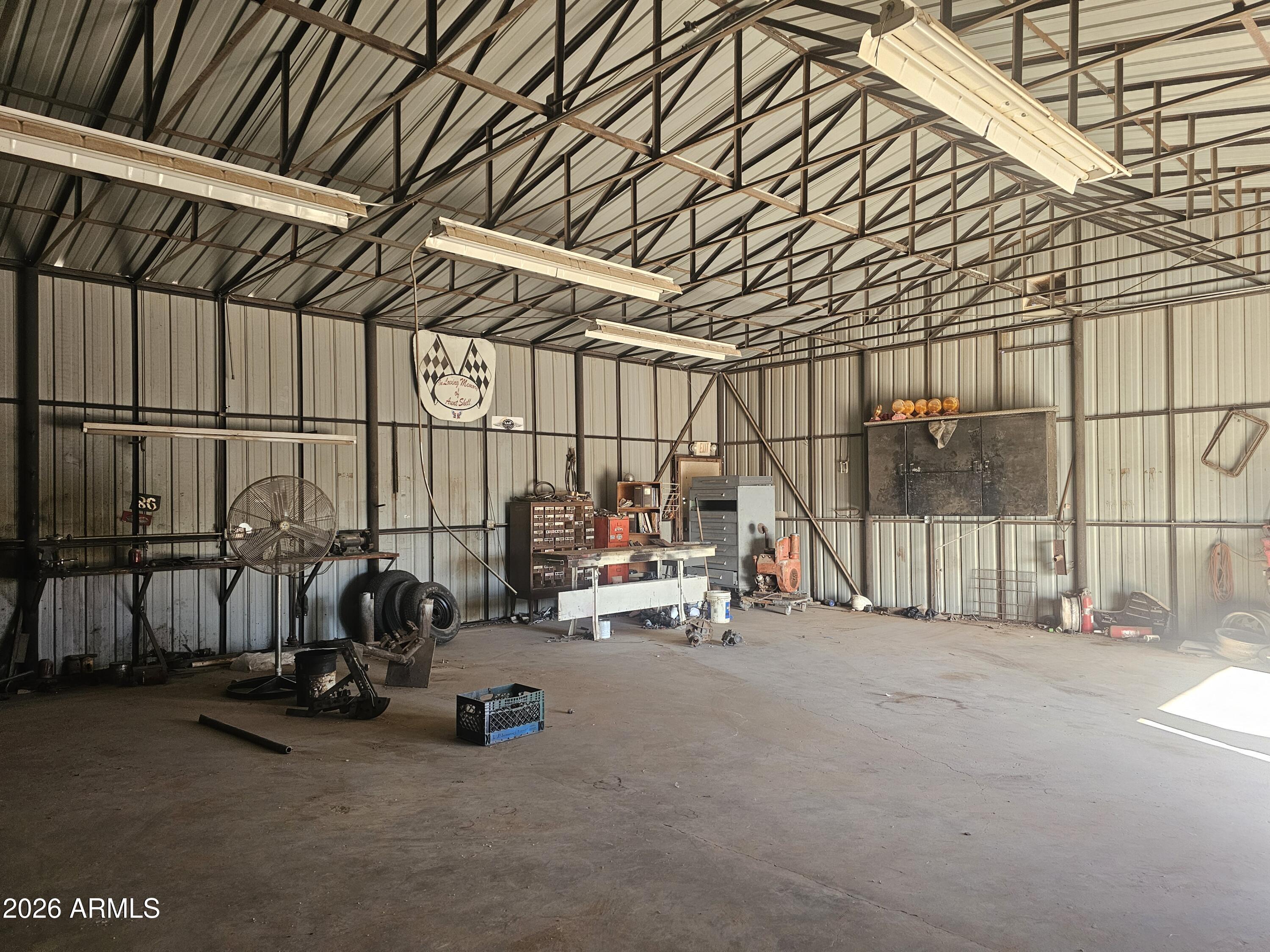 3613 North Papoose Road, Unit 3613 Casa Grande, AZ 85193 - Photo 4 of 19 a view of garage with parked