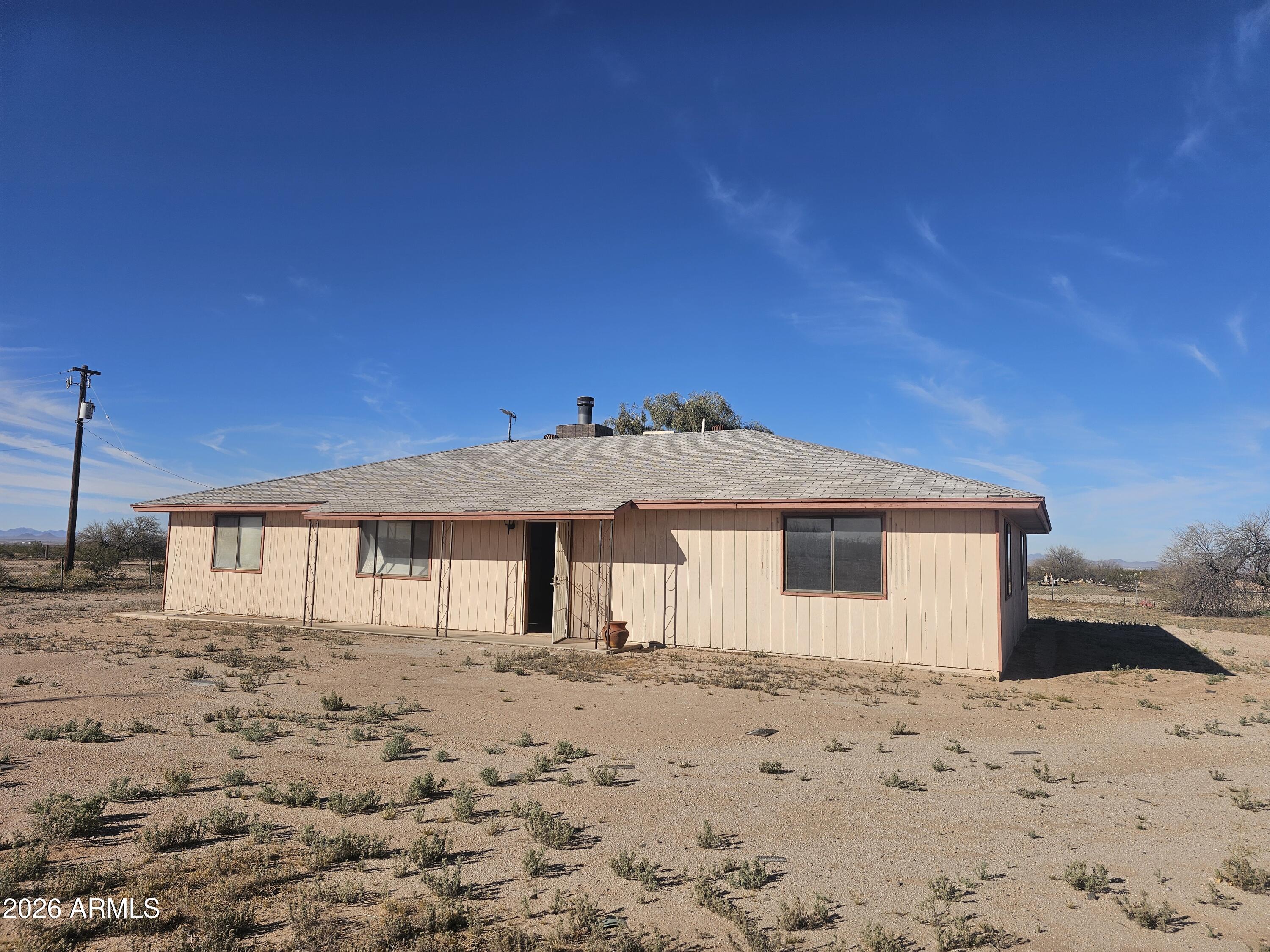 3613 North Papoose Road, Unit 3613 Casa Grande, AZ 85193 - Photo 9 of 19 a front view of a house with a yard