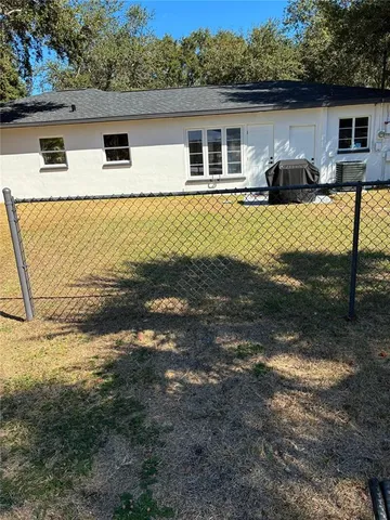 a front view of house with yard space and seating