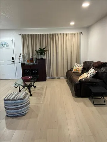 a bedroom with a bed and a chair