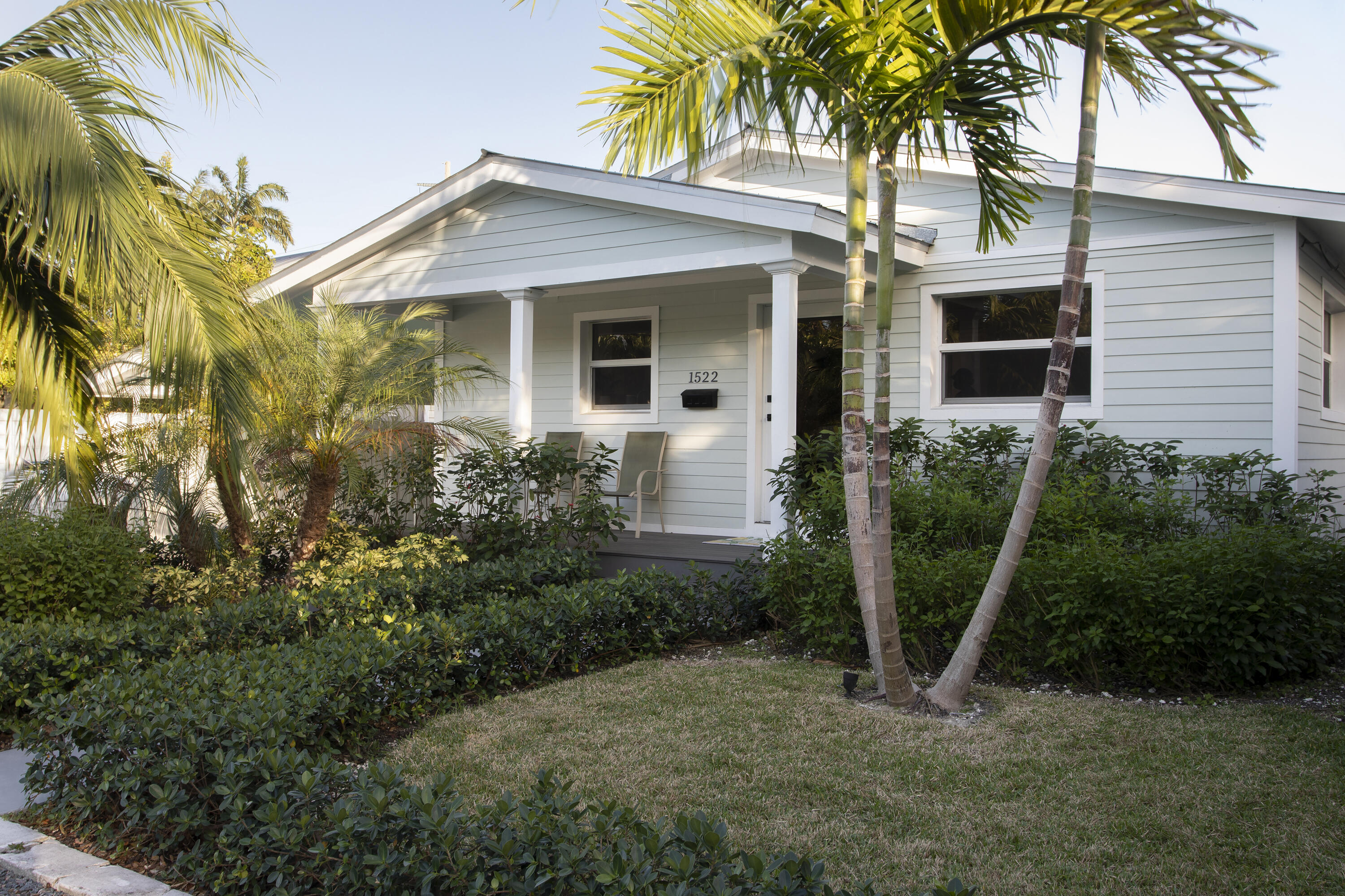 1522 Washington Street Key West, FL 33040 - Photo 1 of 21 a front view of a house with a garden