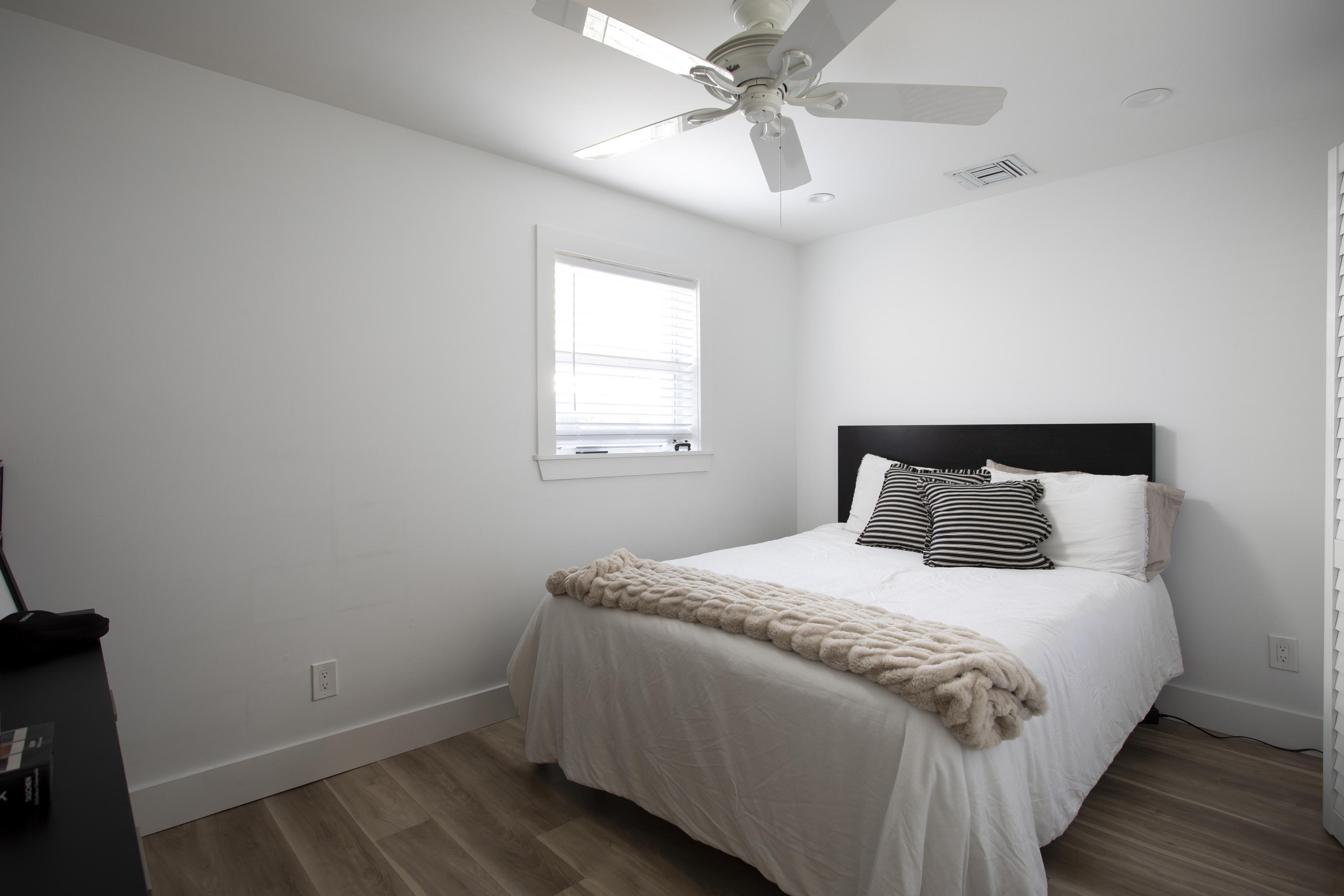 1522 Washington Street Key West, FL 33040 - Photo 14 of 21 a bedroom with a bed and wooden floor
