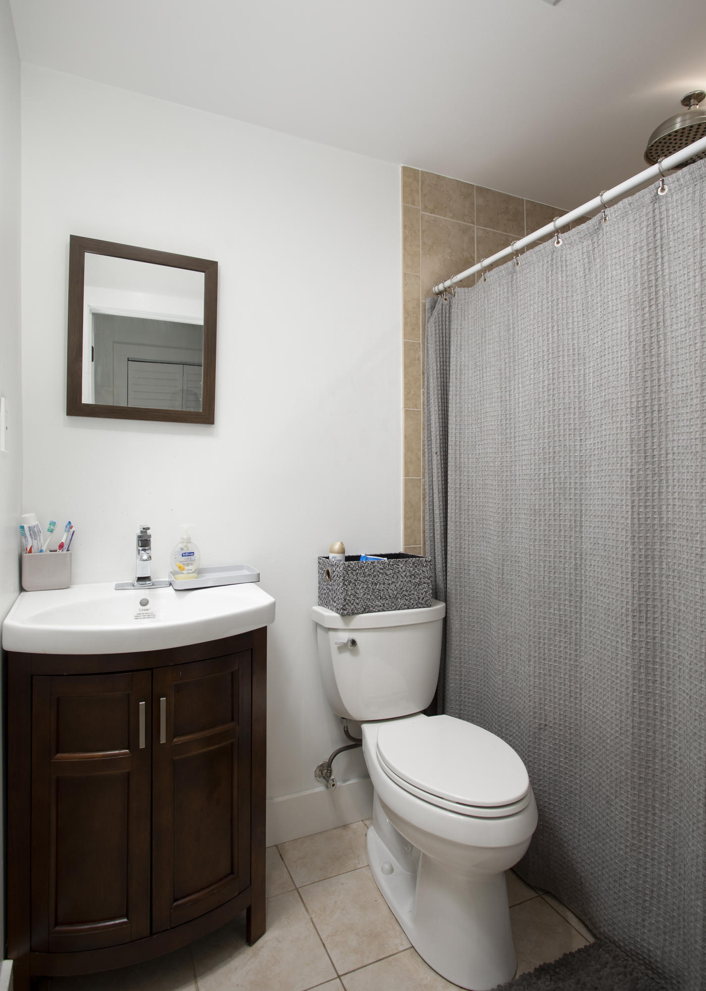 1522 Washington Street Key West, FL 33040 - Photo 16 of 21 a bathroom with a toilet a sink and a mirror