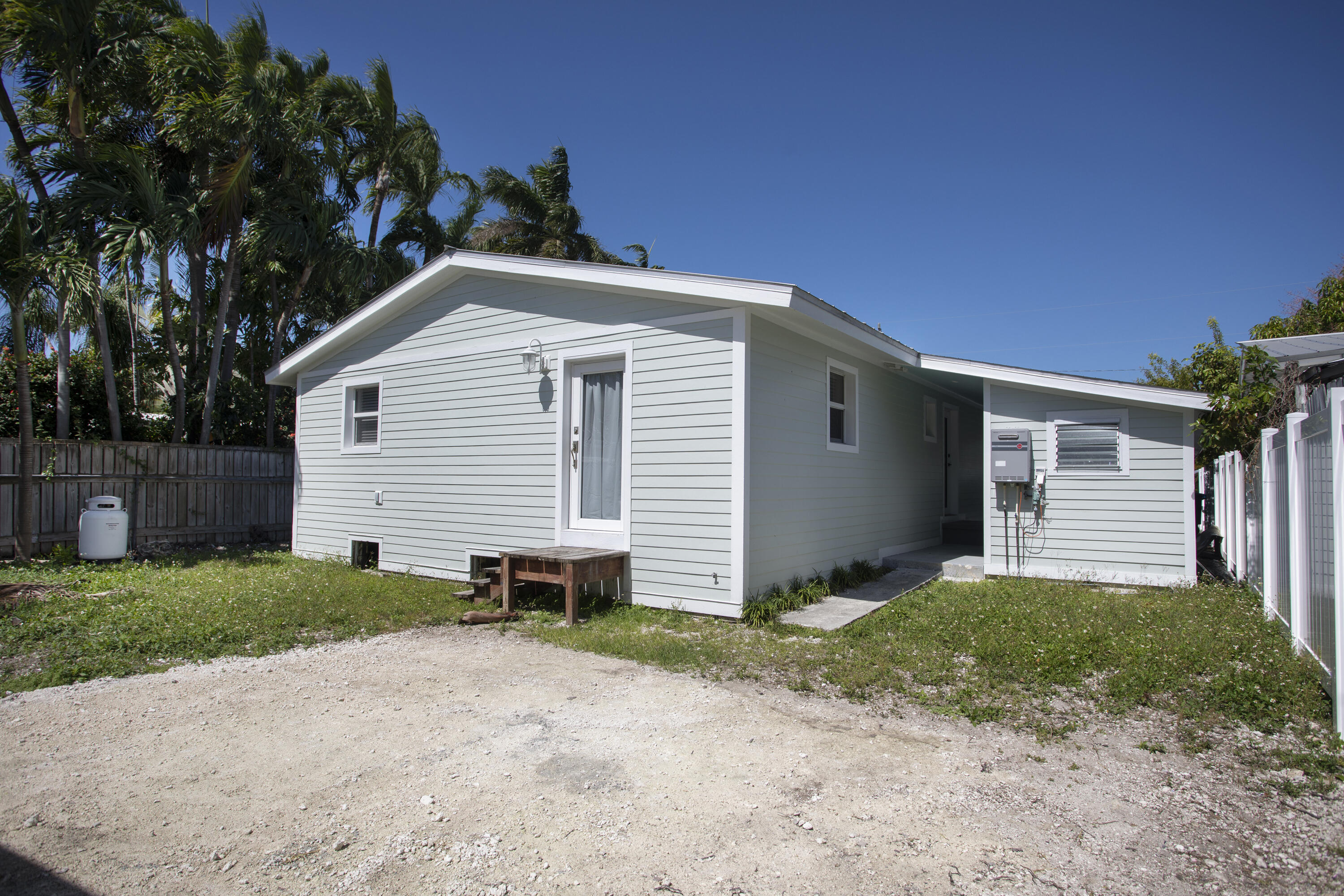 1522 Washington Street Key West, FL 33040 - Photo 18 of 21 a view of a house with a yard and garage