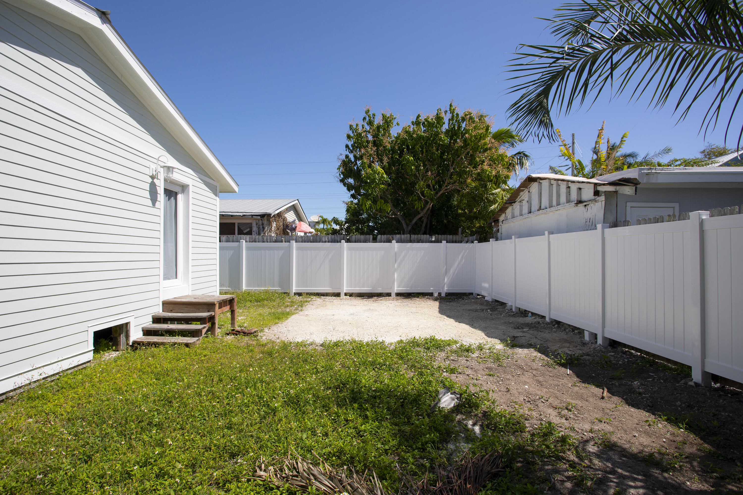 1522 Washington Street Key West, FL 33040 - Photo 20 of 21 a backyard of a house with lots of green space