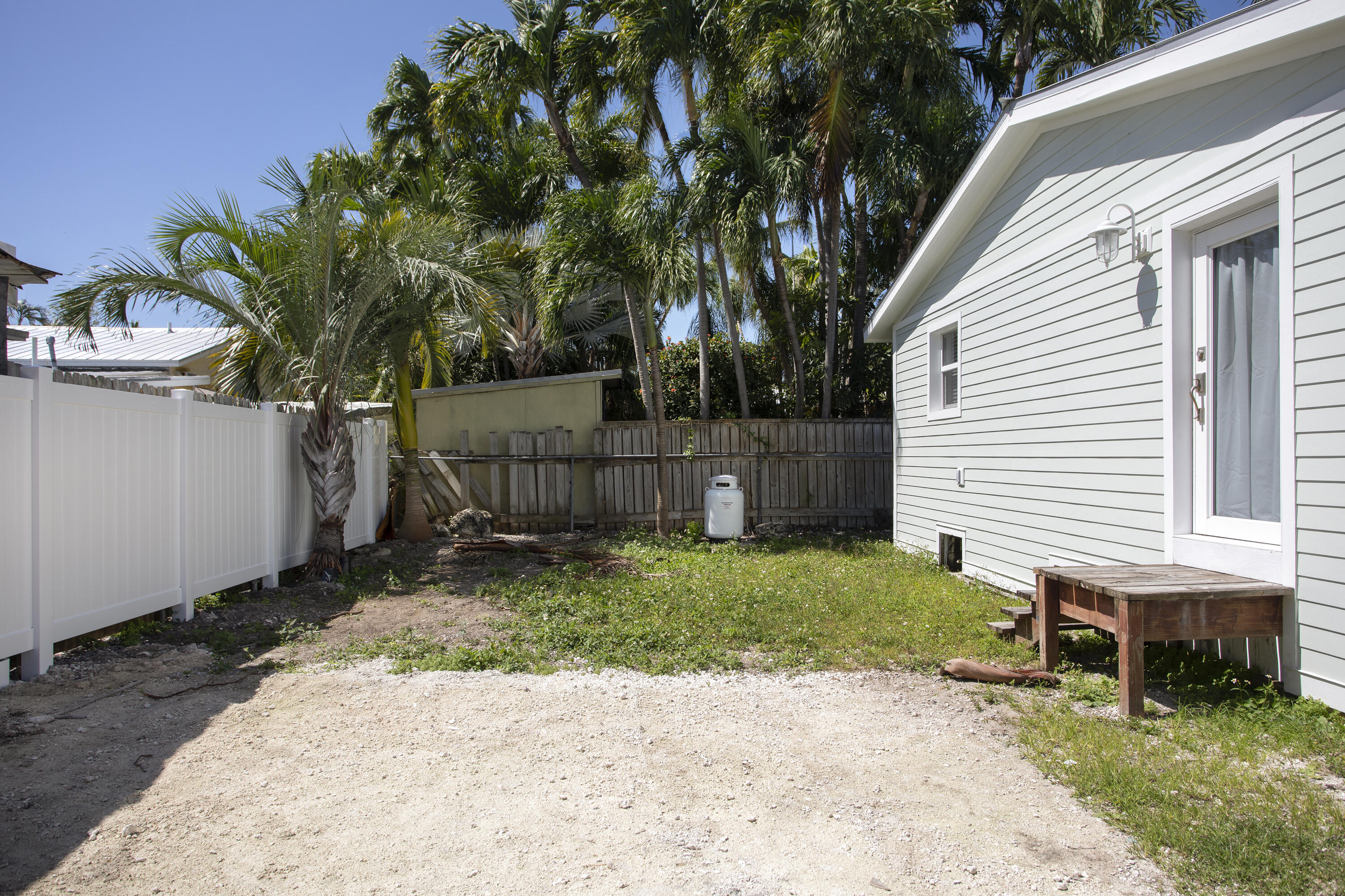 1522 Washington Street Key West, FL 33040 - Photo 21 of 21 a backyard of a house with plants and tree