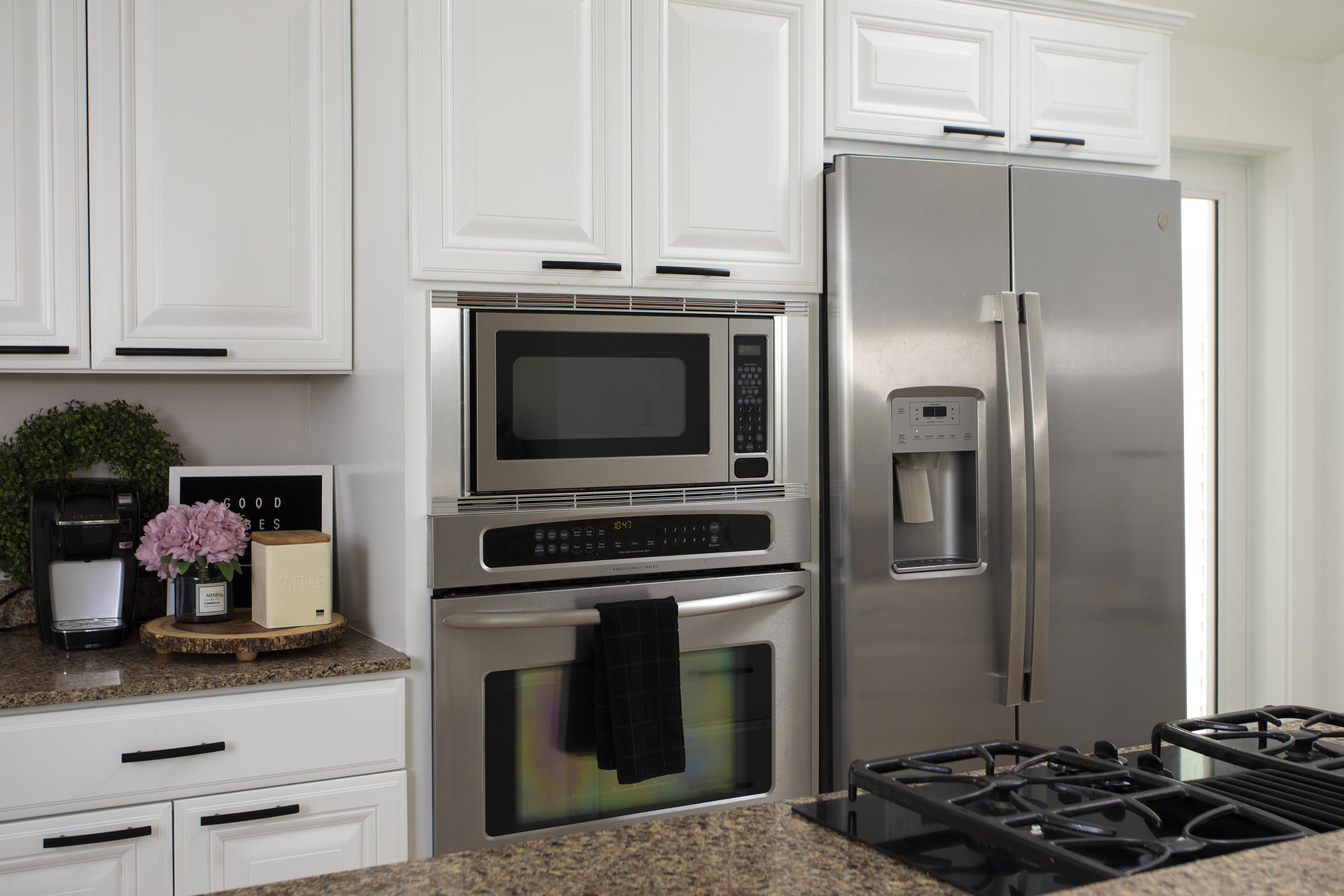 1522 Washington Street Key West, FL 33040 - Photo 8 of 21 a kitchen with stainless steel appliances granite countertop a stove and a refrigerator