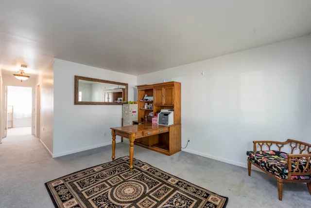 a area with wooden floor and furniture