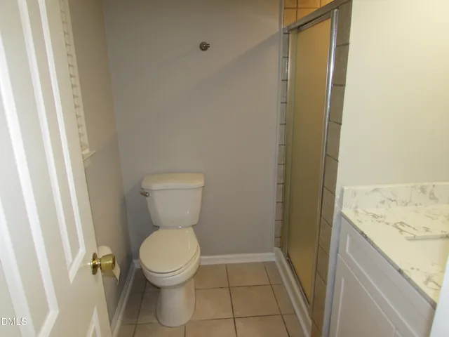 a bathroom with a toilet and a sink