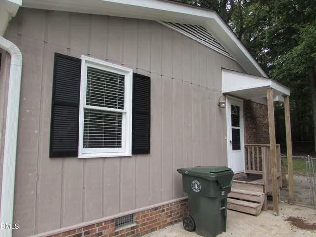 a front view of a house with stairs