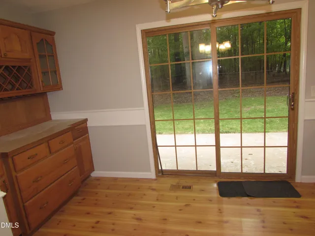 a view of a door and window in an empty room