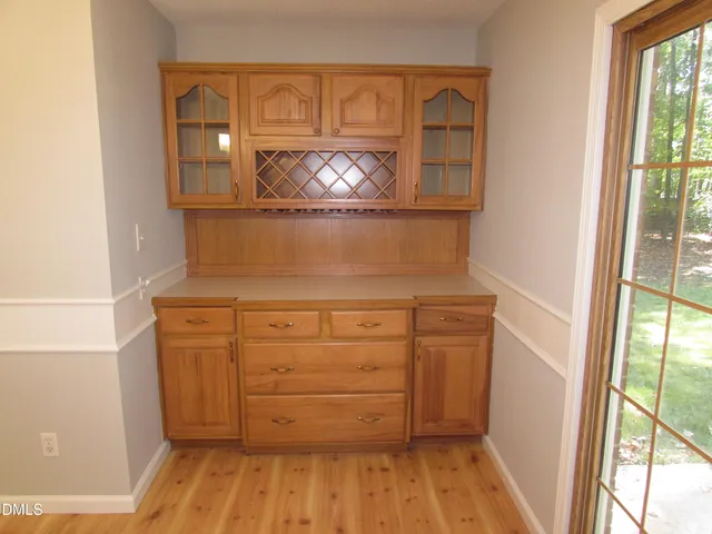 a view of a dresser with wooden floor