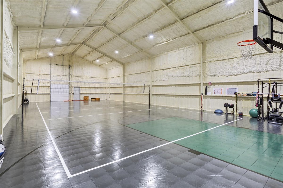 10940 Wedel Cemetery Road Rogers, TX 76569 - Photo 29 of 31 An indoor sports court offers ample space for recreation and fitness activities.