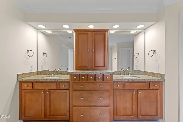 an empty room with closet and a chandelier fan