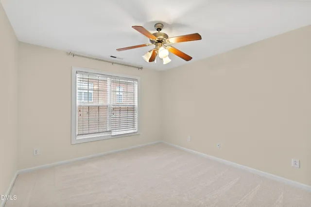 a view of a street with a building in the background