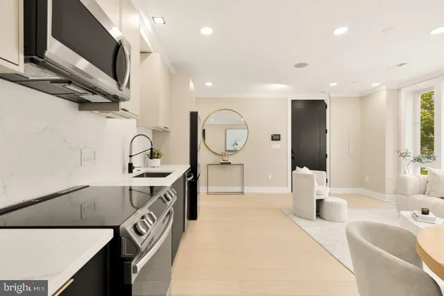 a spacious bathroom with a sink a mirror and a bathtub