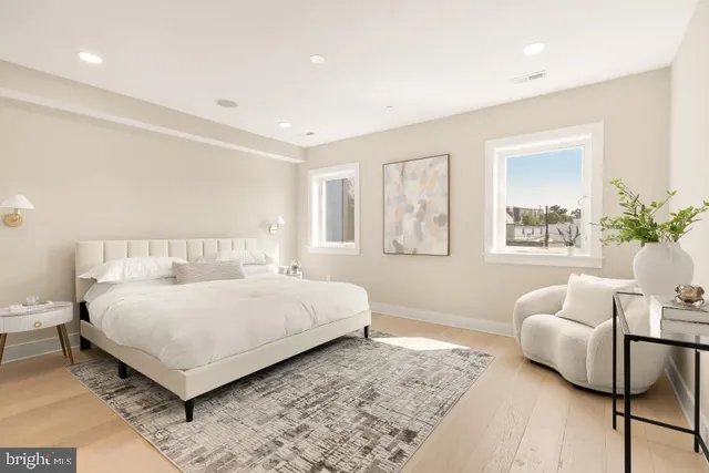 a bedroom with a large bed and a couch