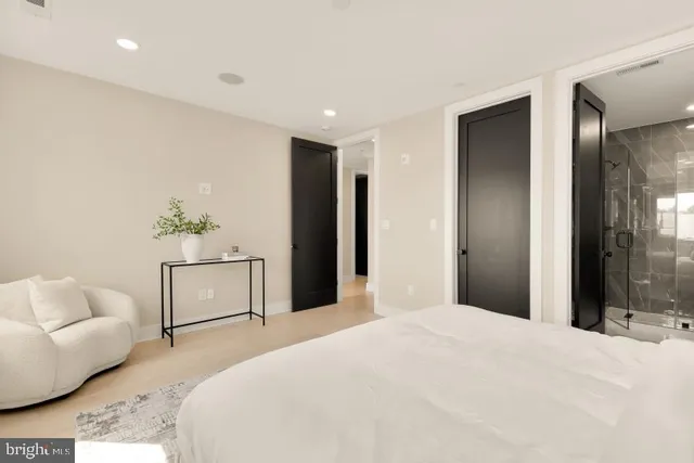 a bedroom with a bed and a couch