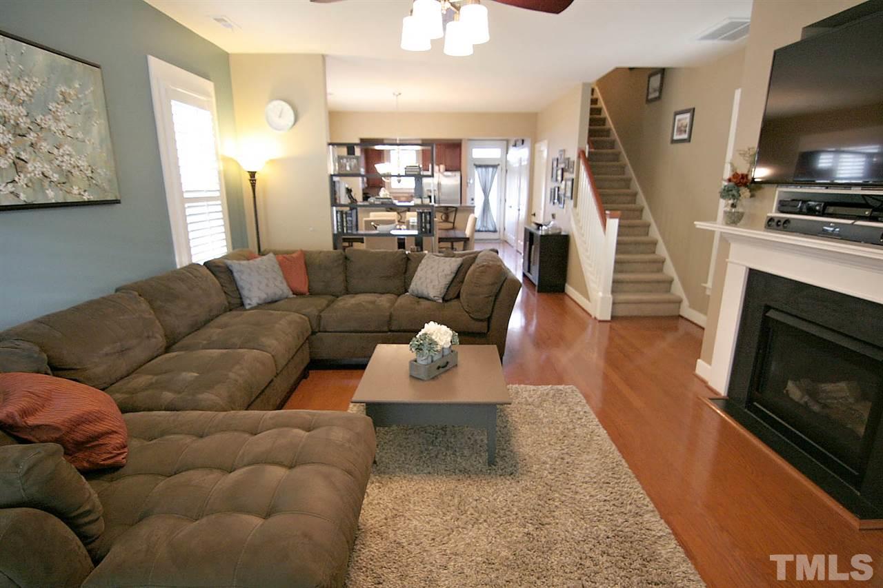 2248 Dunlin Lane Raleigh, NC 27614 - Photo 6 of 24 a living room with furniture flat screen tv and a fireplace