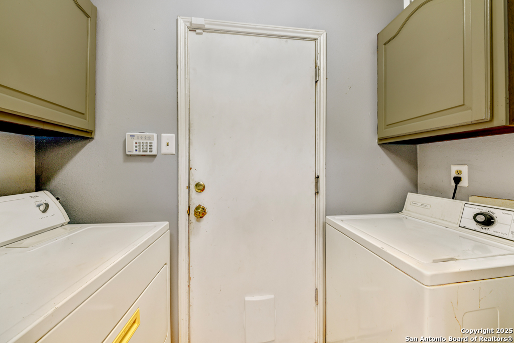 15010 Spring Shower San Antonio, TX 78247 - Photo 12 of 27 a utility room with dryer and washer