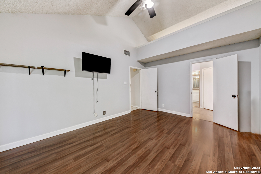 15010 Spring Shower San Antonio, TX 78247 - Photo 17 of 27 wooden floor in an empty room with a window