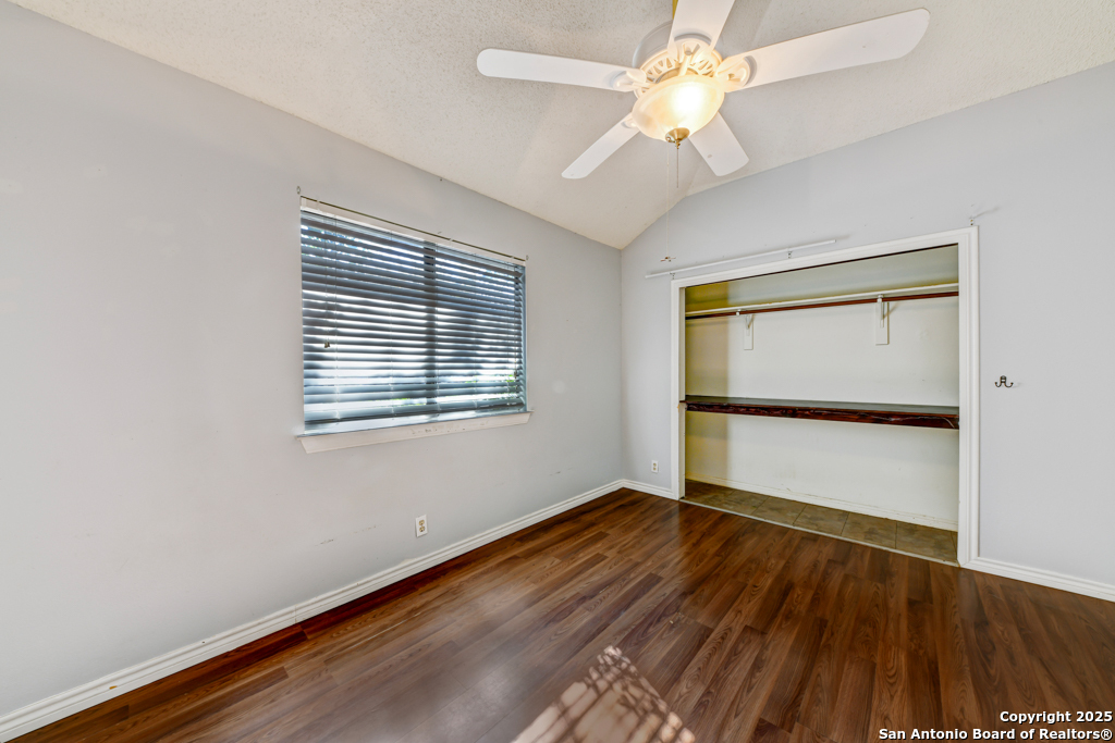 15010 Spring Shower San Antonio, TX 78247 - Photo 19 of 27 a view of an empty room with wooden floor and a window