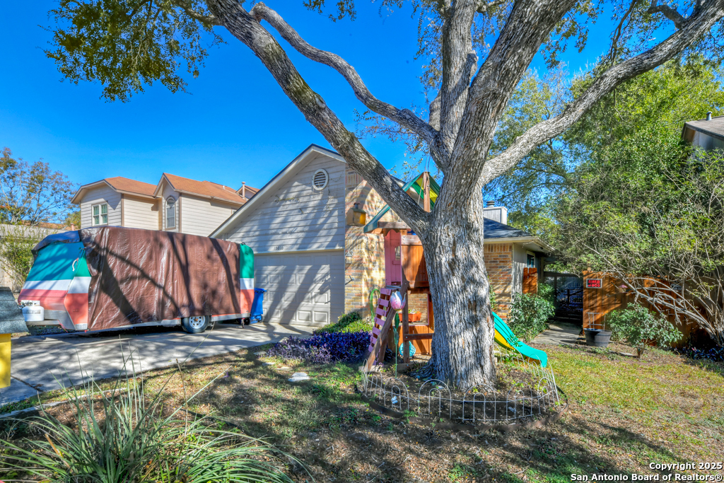 15010 Spring Shower San Antonio, TX 78247 - Photo 2 of 27 a view of a park with iron fence