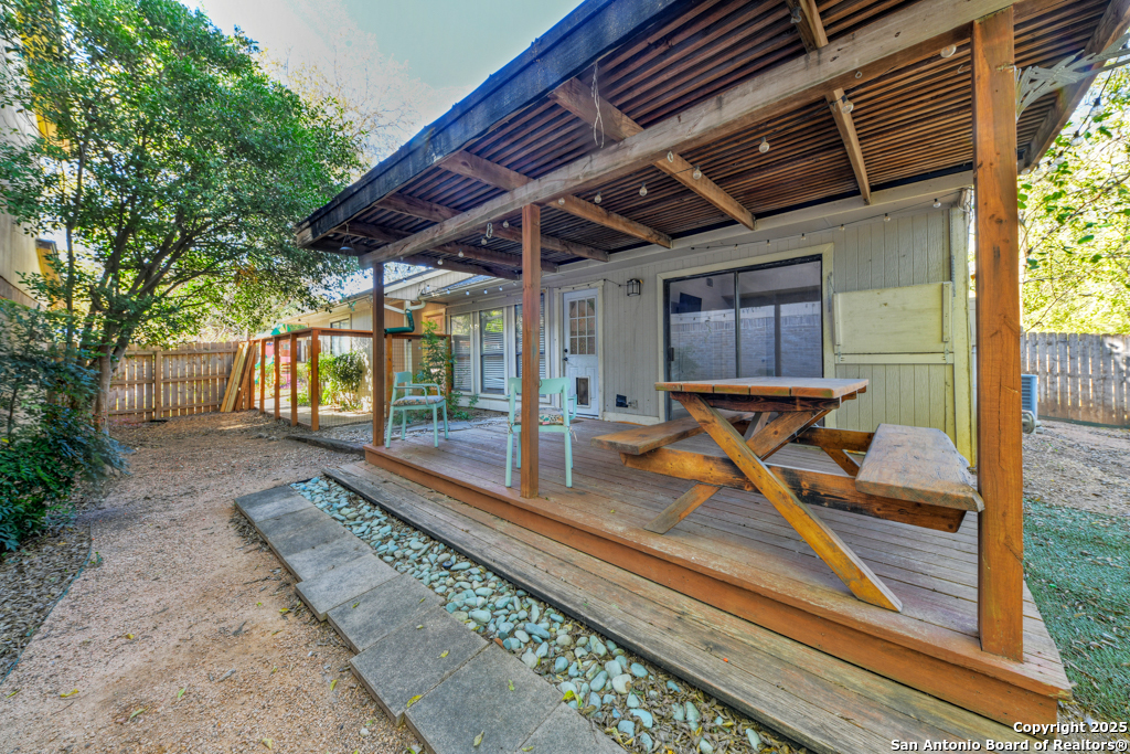 15010 Spring Shower San Antonio, TX 78247 - Photo 25 of 27 a view of a backyard with a patio