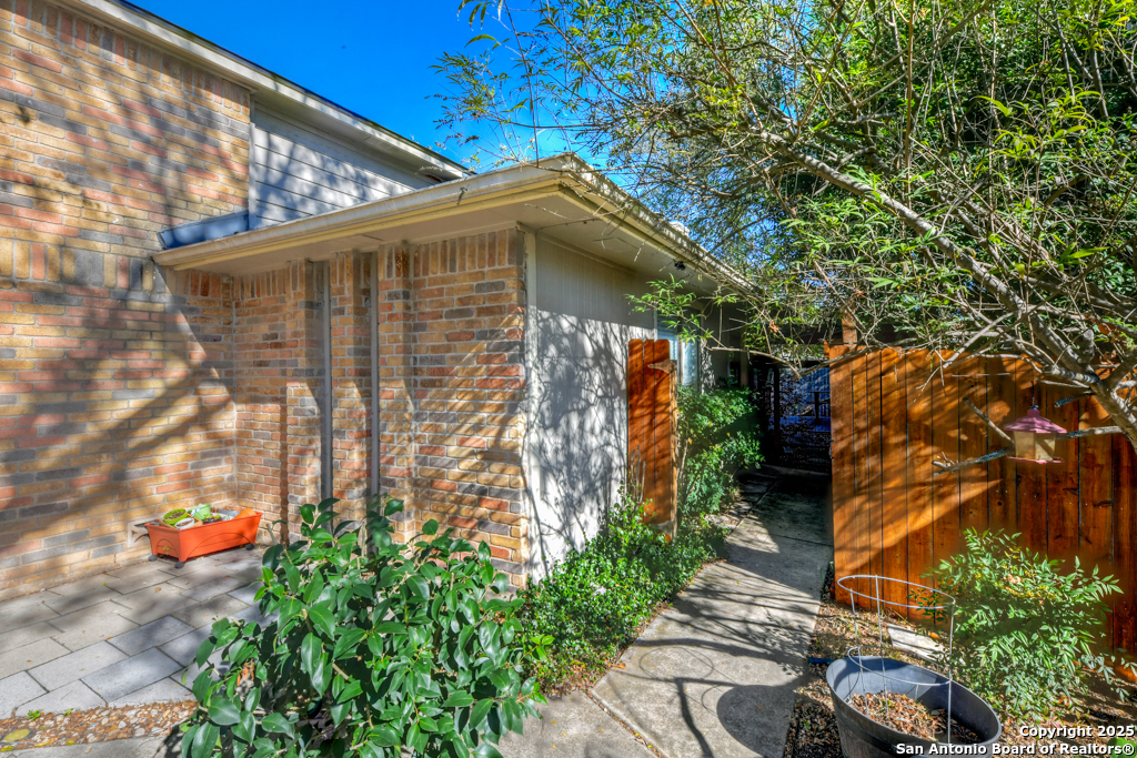 15010 Spring Shower San Antonio, TX 78247 - Photo 5 of 27 a backyard of a house with lots of green space