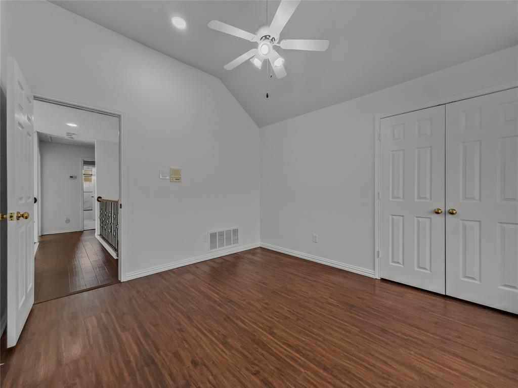 2317 Wellesly Road Rowlett, TX 75089 - Photo 25 of 39 a view of an empty room with wooden floor