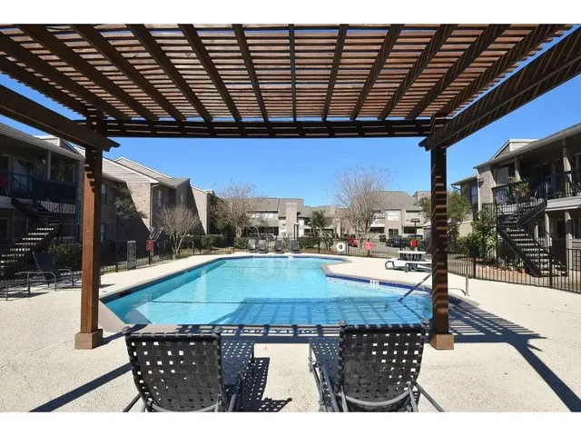 a outdoor space with pool and furniture