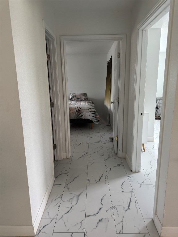 968 Red Town Road Elgin, TX 78621 - Photo 10 of 36 Hallway with light marble finish floors and baseboards