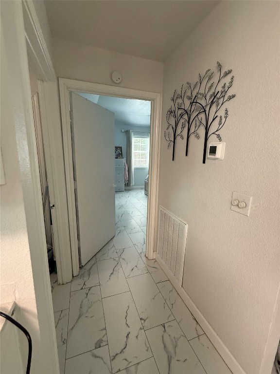 968 Red Town Road Elgin, TX 78621 - Photo 13 of 36 Corridor with light marble finish floors and baseboards