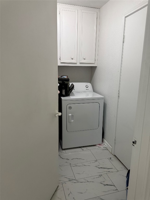968 Red Town Road Elgin, TX 78621 - Photo 14 of 36 Laundry room featuring cabinet space, washer / dryer, and light marble finish floors