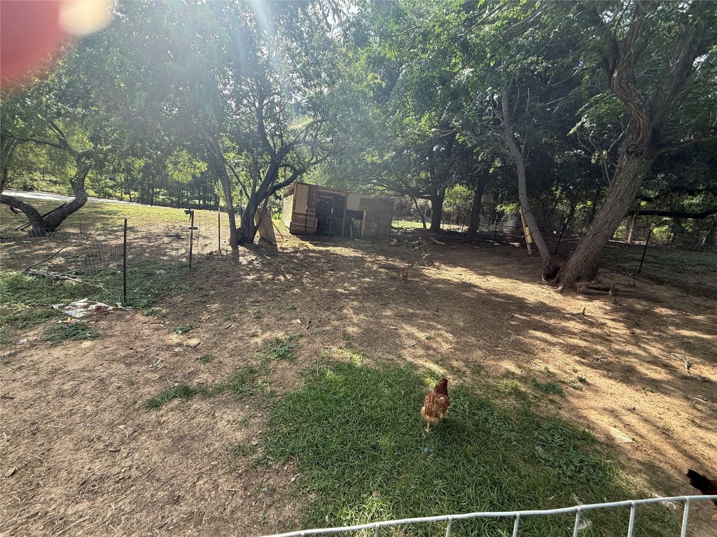 968 Red Town Road Elgin, TX 78621 - Photo 25 of 36 View of yard with an outbuilding