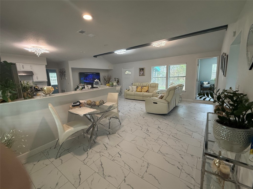 968 Red Town Road Elgin, TX 78621 - Photo 3 of 36 Living room with light marble finish floors, recessed lighting, and vaulted ceiling