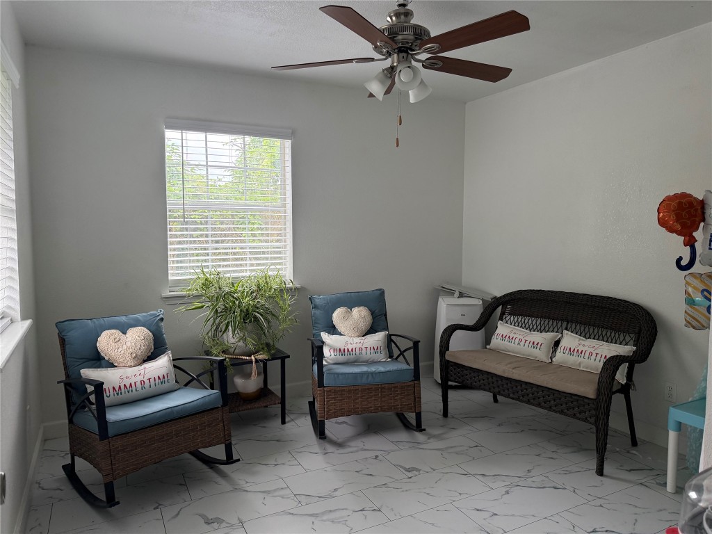 968 Red Town Road Elgin, TX 78621 - Photo 6 of 36 Sitting room featuring marble finish flooring and ceiling fan