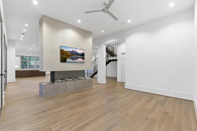 an entryway with wooden floor and livingroom view
