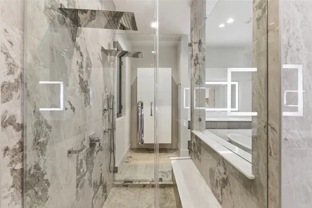 a bathroom with a tub shower and sink