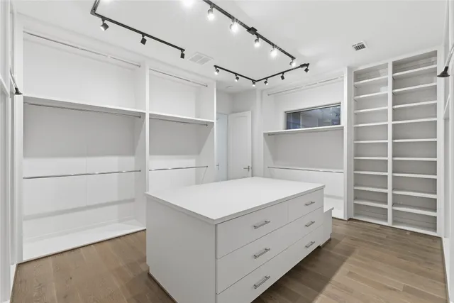 a view of an empty walk in closet