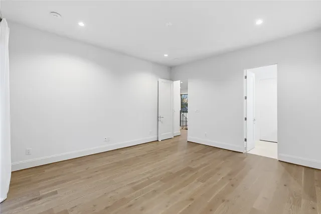 a bathroom with a granite countertop sink a mirror and a shower