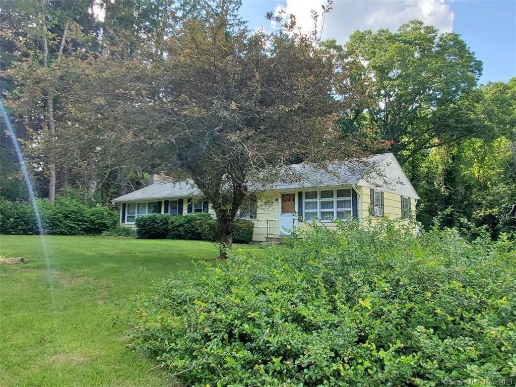 407 Highway 2 Preston, CT 06365 - Photo 1 of 1 a front view of a house with a yard and trees