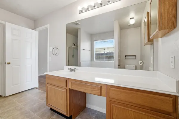 a room with a sink and a mirror