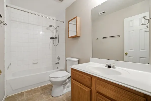 a view of room with window and ceiling fan