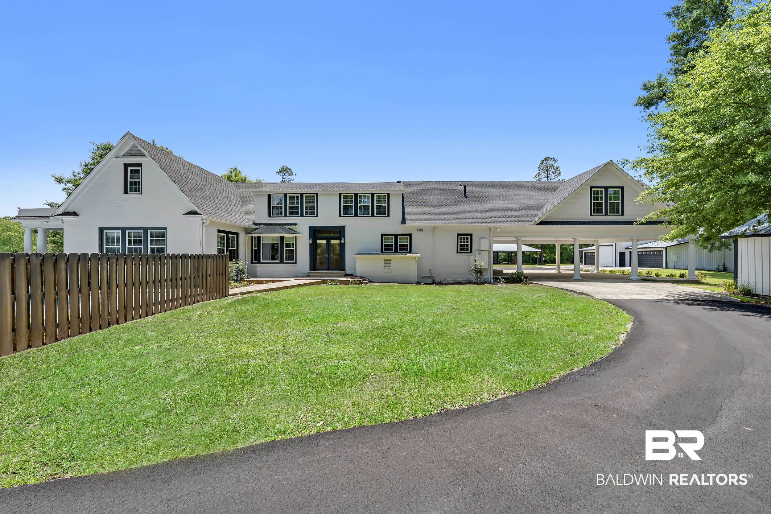 43199 Pine Grove Road Bay Minette, AL 36507 - Photo 9 of 71 Expansive white exterior with dark trim and multiple gables
