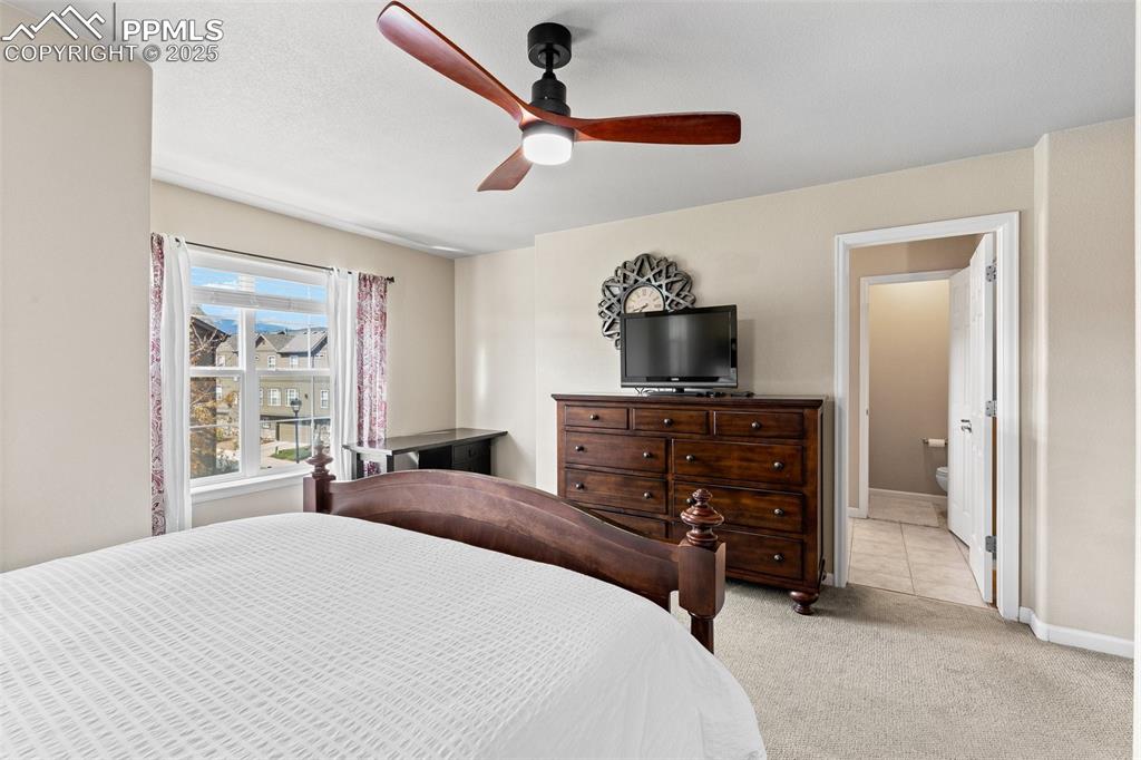 4073 Flash Point Colorado Springs, CO 80907 - Photo 11 of 20 a bedroom with a bed and a dresser