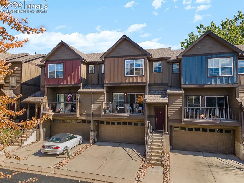 4073 Flash Point Colorado Springs, CO 80907 - Photo 20 of 20 a front view of a residential apartment building with a yard